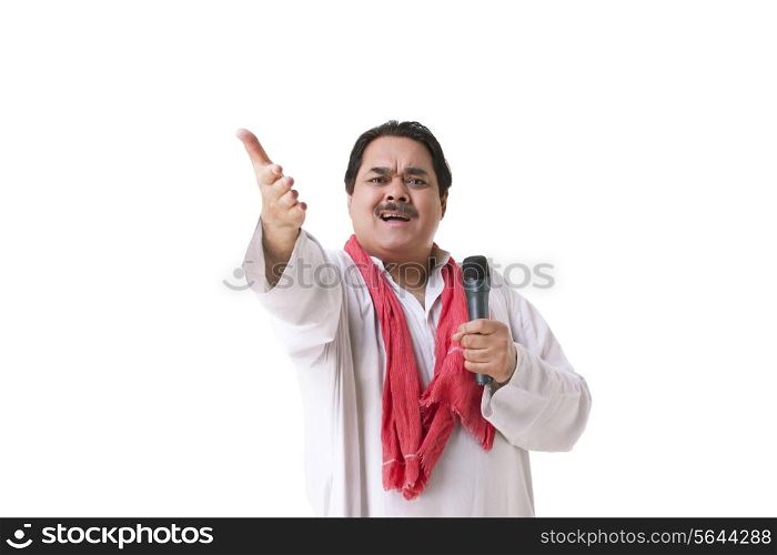 Male politician with microphone gesturing