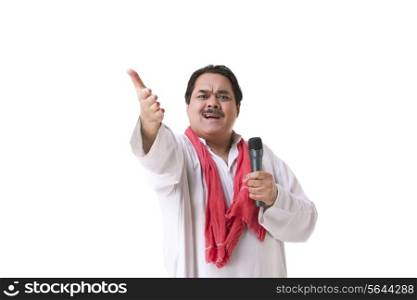 Male politician with microphone gesturing