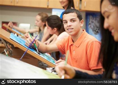 Male Pupil In High School Art Class