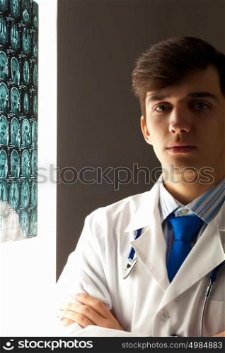 Male radiologist. Image of male radiollogist with x-ray results