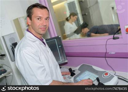 male radiologist taking xray of man