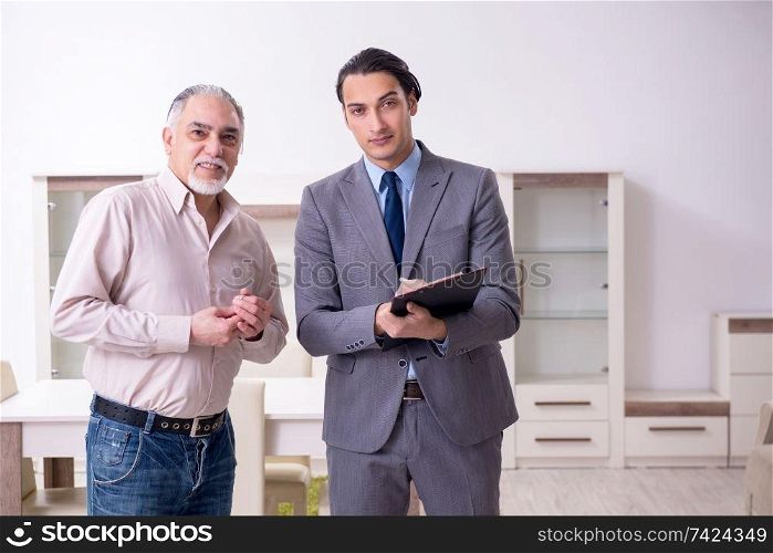Male real estate agent and male client in the apartment 