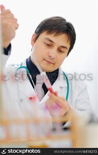 Male researcher working with blood sample