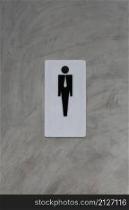 Male restroom sign on grey vintage cement wall background for design in your work.
