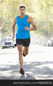 Male Runner Exercising On Suburban Street