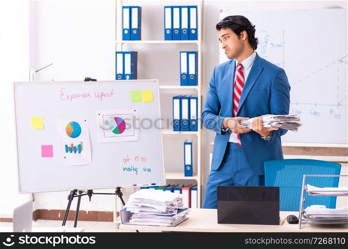 Male sales analyst in front of the whiteboard 