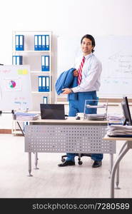 Male sales analyst in front of the whiteboard 