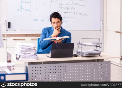 Male sales analyst in front of the whiteboard 