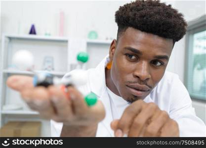 male scientist experimenting molecule structure