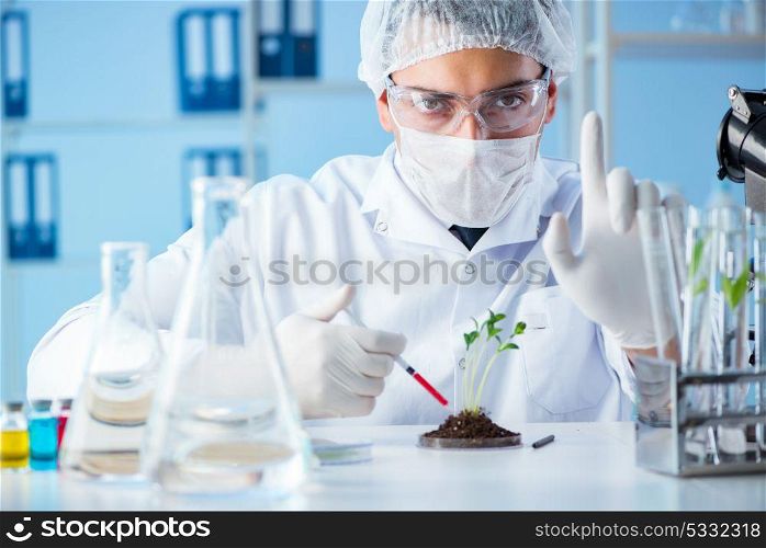 Male scientist researcher doing experiment in a laboratory