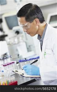 Male Scientist Working In Laboratory