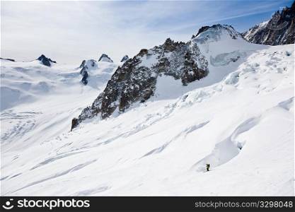 Male skier moving down in snow powder; envers du plan, vallA?e blanche, Chamonix, Mont Blanc massif, France, Europe.