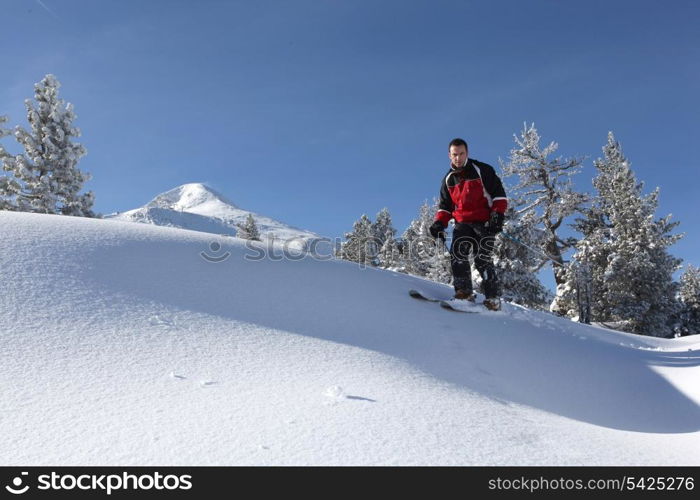 Male skier on a ski slope