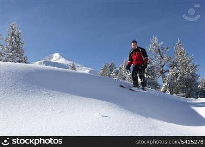 Male skier on a ski slope