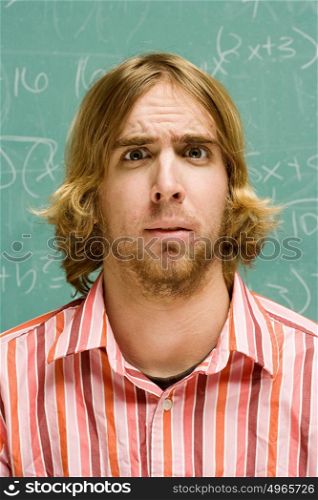 Male student looking confused