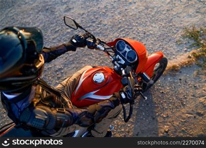 Male student on motorbike, top view, lesson in motorcycle school. Training of motorcyclists beginners, biker practicing on motordrome in motorschool. Student on motorbike, top view, motorcycle school