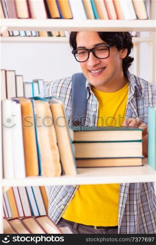 Male student preparing for exams at library 