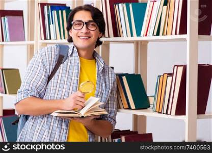 Male student preparing for exams at library 