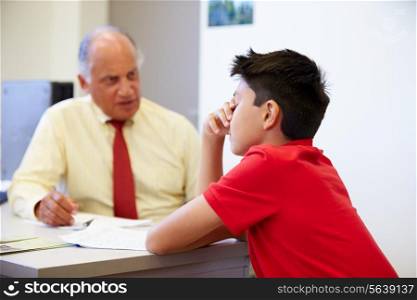 Male Student Talking To High School Counselor