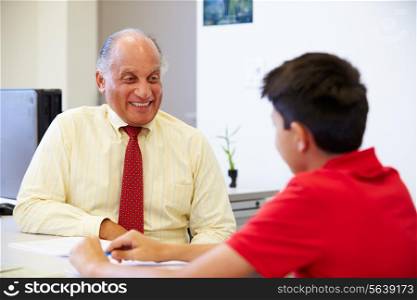 Male Student Talking To High School Counselor