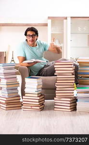 Male student with many books at home 