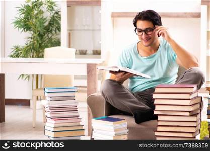 Male student with many books at home
