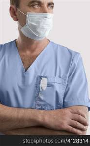 Male surgeon wearing a surgical mask