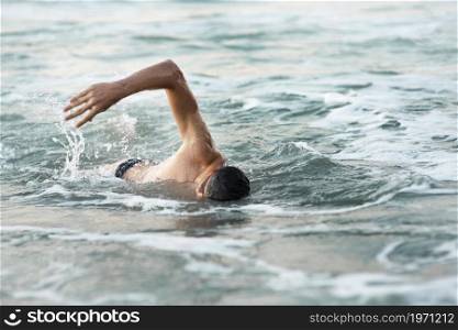 male swimmer swimming ocean. High resolution photo. male swimmer swimming ocean. High quality photo