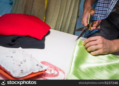 Male tailor working in sewer shop