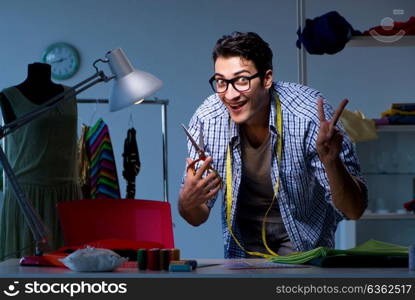 Male tailor working in sewer shop