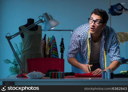 Male tailor working in sewer shop