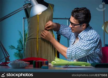 Male tailor working in sewer shop