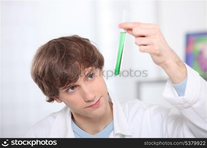 Male teenager in science laboratory