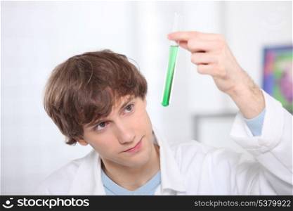 Male teenager in science laboratory