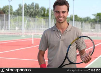 Male tennis player on a hardcourt
