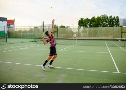 Male tennis players with rackets, training on outdoor court. Active healthy lifestyle, people play sport game, fitness workout with racquets. Male tennis players, training on outdoor court