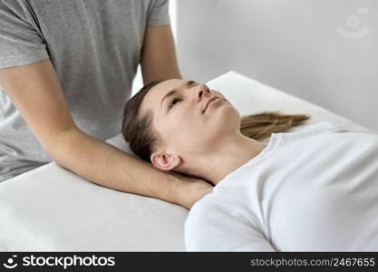 male therapist undergoing physical therapy with female patient 2
