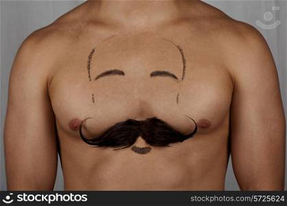 male torso with moustache and beard at chest