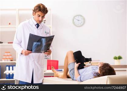 Male traumatologist looking at xray images . Male traumatologist looking at xray images  