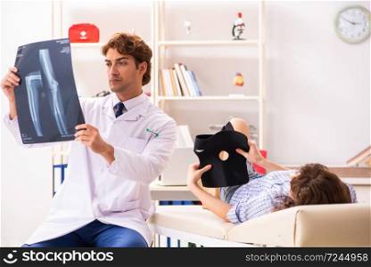 Male traumatologist looking at xray images . The male traumatologist looking at xray images 