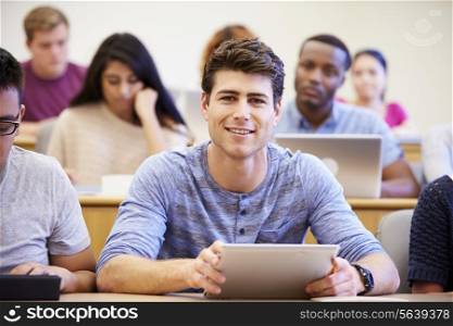 Male University Student Using Digital Tablet In Lecture