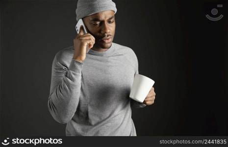 male wearing cap talking phone 3