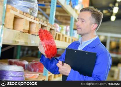 male worker is checking the items