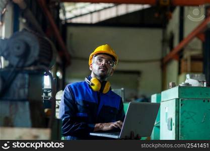 male worker or engineer Inspecting industrial machinery. The concept of a heavy industrial plant.