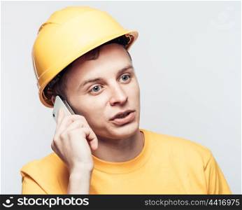 Male worker talking on mobile phone