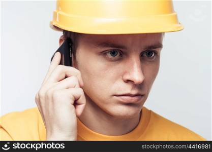 Male worker talking on mobile phone