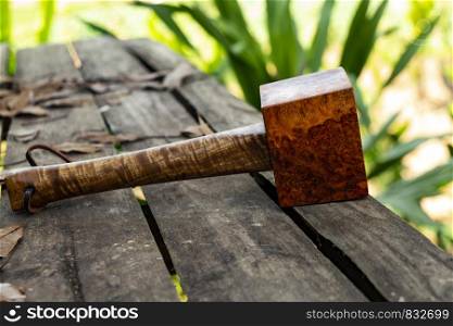 Mallet hammer made of burl wood tools for used by carpenter in workshop on isolated blurred blackground