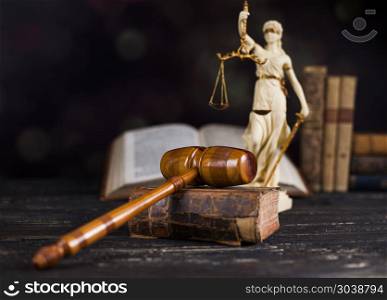 Mallet of the judge, justice scale, wooden desk background. Law theme, mallet of judge, wooden gavel