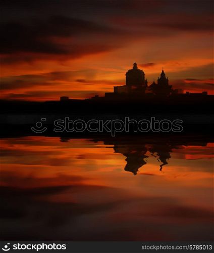malta island at sunset with water reflection