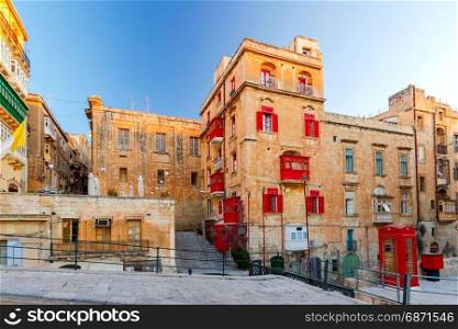 Malta. Traditional balconies on the houses.. Traditional multi-colored wooden balconies on the houses. Valletta. Malta.